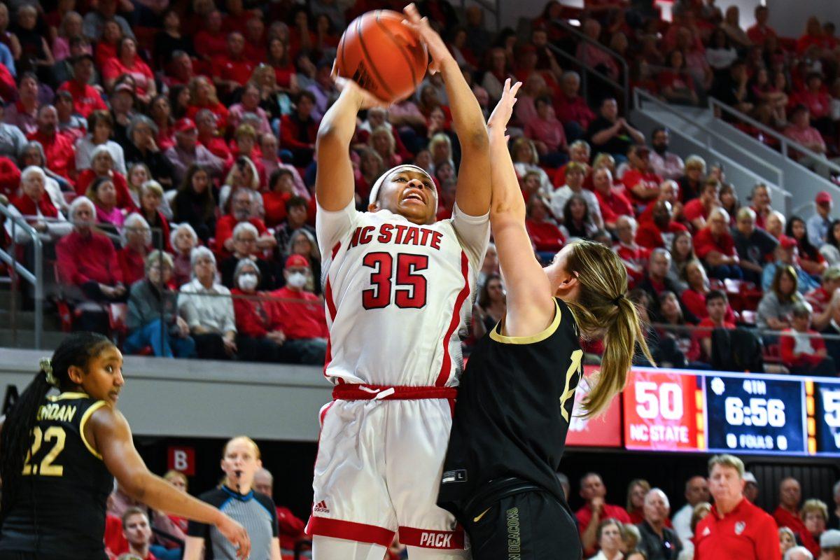 Freshman guard Zoe Brooks attempts a contested layup during the game against Wake Forest in Reynolds Coliseum on Sunday, March 3, 2024. NC State won against Wake Forest 75-57.
