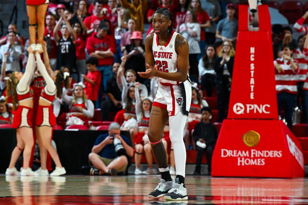 Junior guard Saniya Rivers claps after the made free throws during the game against Wake Forest in Reynolds Coliseum on Sunday, March 3, 2024. NC State won against Wake Forest 75-57.