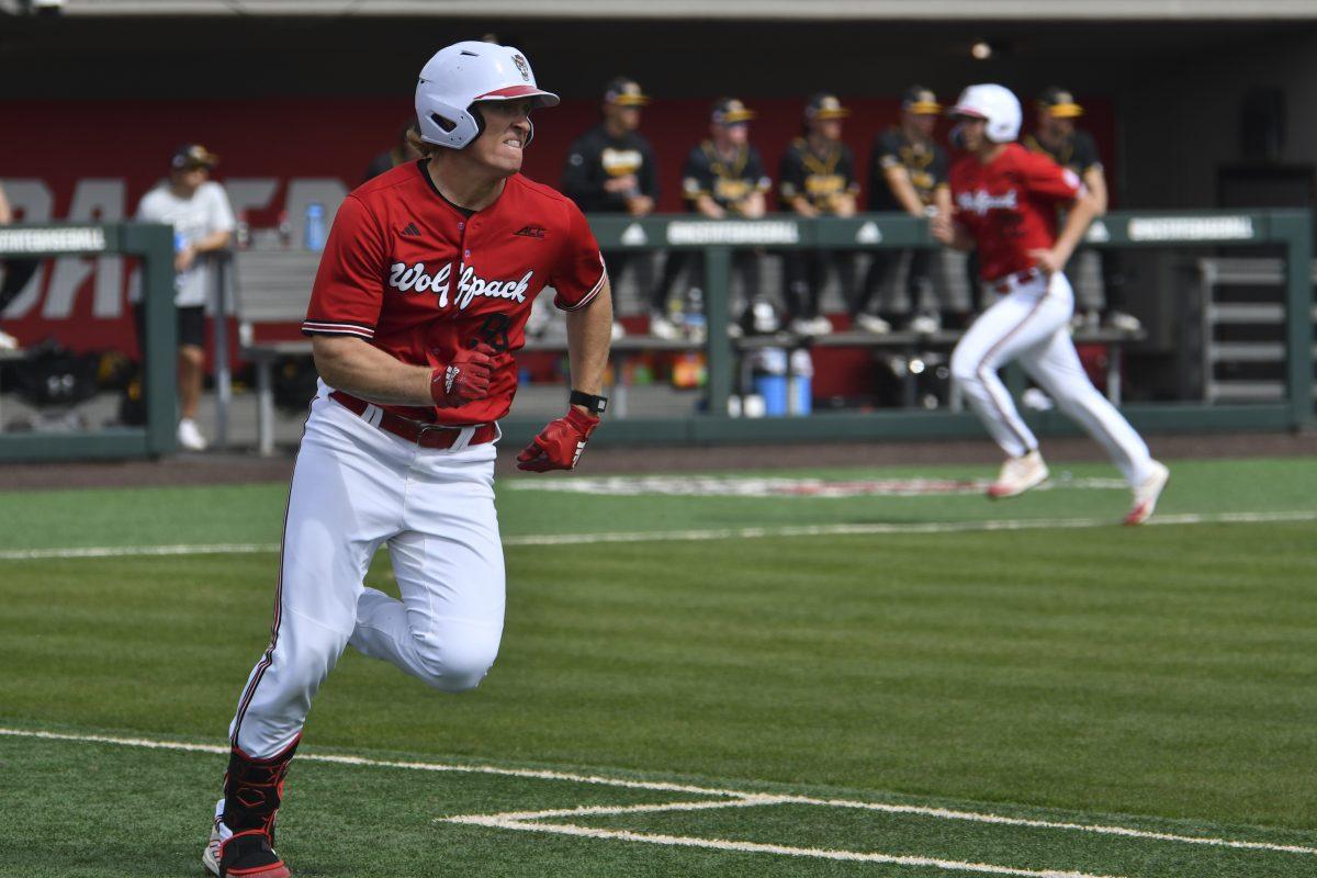 Graduate infielder Alec Makarewicz hits a RBI double during the Wolfpack's final home game in the series against the Towson Tigers on Doak Field at Dail Park on Sunday, March 3, 2024. Makarewicz hit for three doubles, recording a .404 batting average and a RBI of five. The Wolfpack swept the Tigers, winning the final game in the series 14-4.