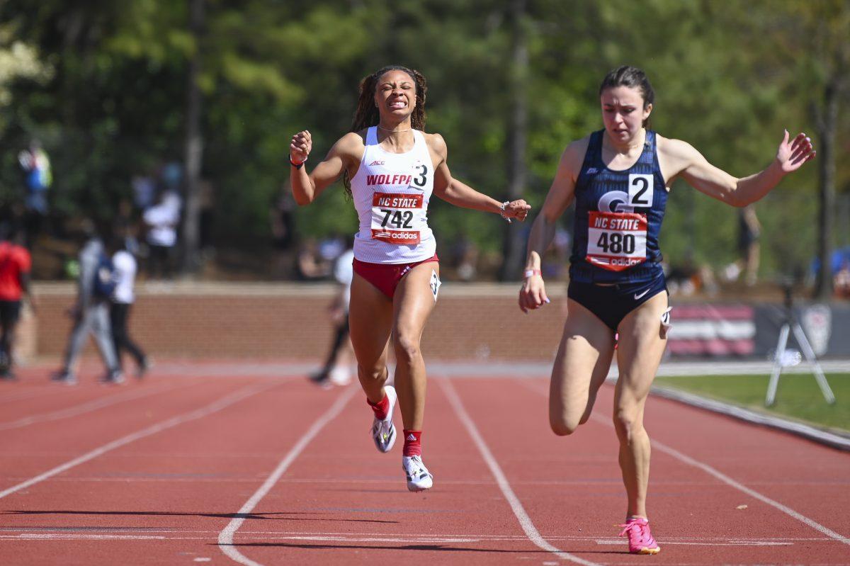 Graduate sprinter Ally Henson pushes to the finish line during the Raleigh Relays track meet at the Derr Track and Field Facility on Saturday, March 30, 2024. Henson finished the 200m dash with a time of 25.31.