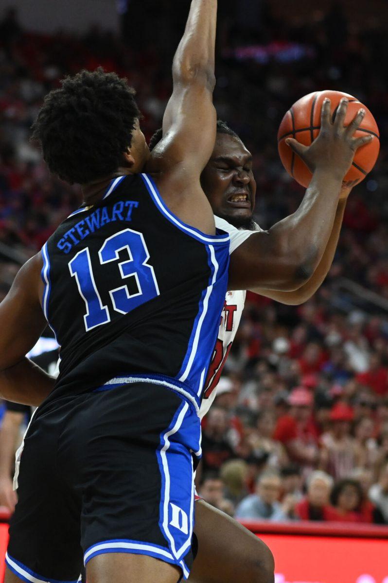 Graduate forward DJ Burns tries to break through to the basket in the game versus the Duke Blue Devils in PNC Arena on Monday, March 4, 2024. Burns led the Wolfpack with 27 points against Duke. The Wolfpack lost to the Blue Devils 79-64.