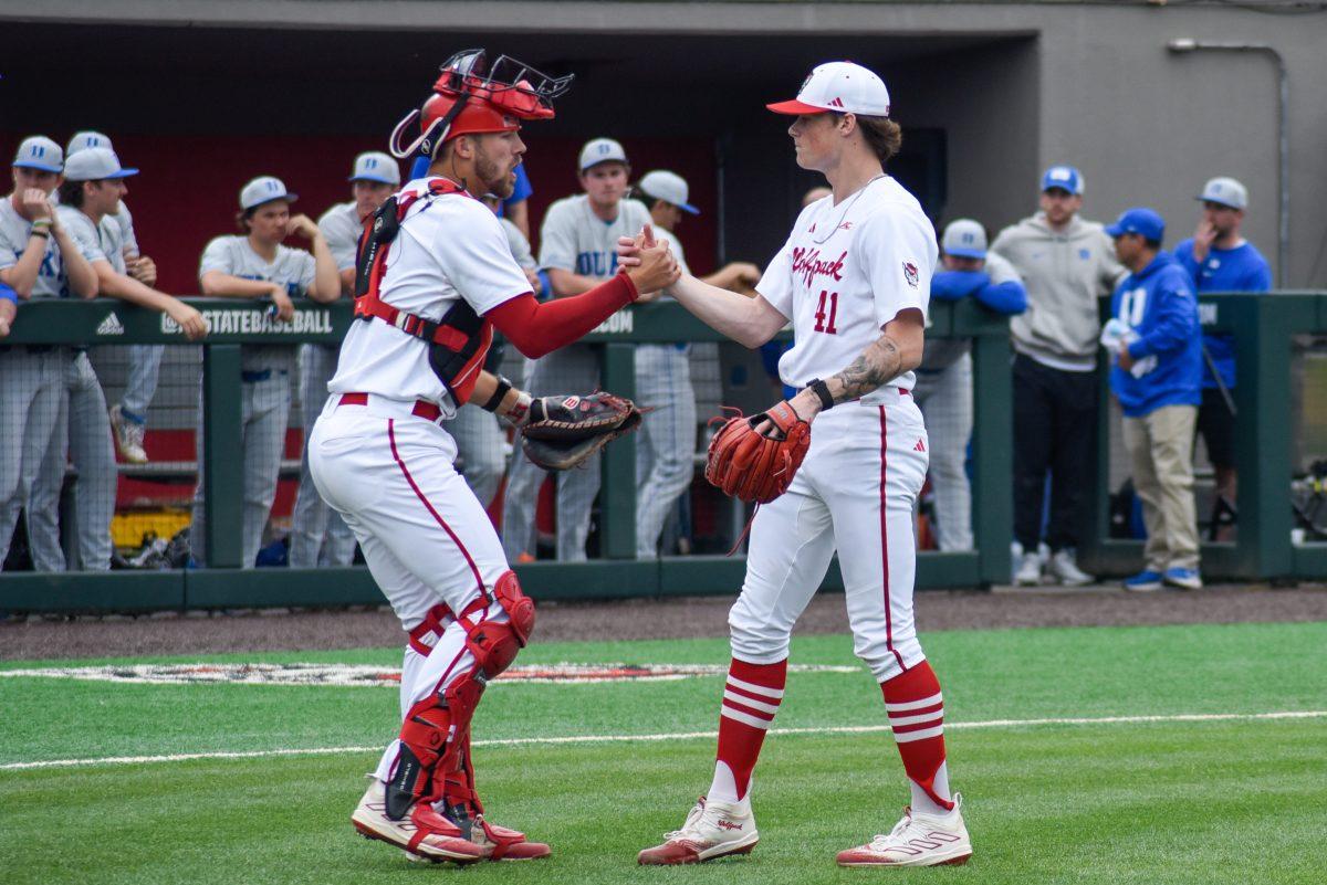 Junior catcher Jacob Cozart and freshman right-handed pitcher Jacob Dudan shake hands after the game against Duke in Doak Field at Dail Park on Friday, March 22, 2024. The Wolfpack defeated the Blue Devils 4-3.