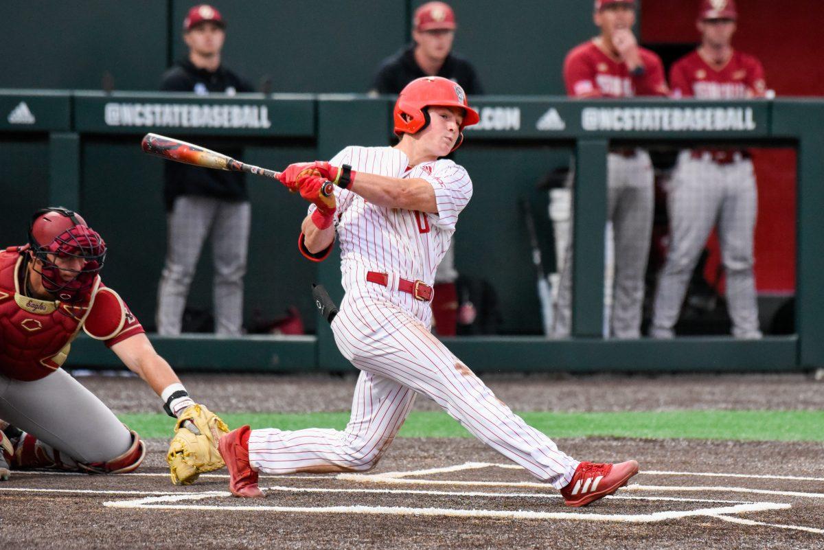 Freshman infielder Luke Nixon finishes his swing during the game against Boston College in Doak Field at Dail Park on Friday, March 8, 2024. The Wolfpack defeated the Eagles 5-4 (11).