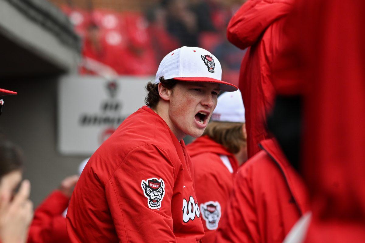 Freshman right-handed pitcher Christopher Zupito cheers on his teammates during the baseball game against Towson at Doak Field at Dail Park on Friday, March 1, 2024. NC State beat Towson 6-5.