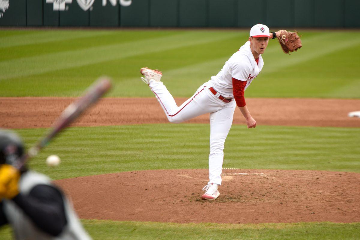 Graduate right-handed pitcher Sam Highfill throws a pitch during the game against Towson in Doak Field at Dail Park on Friday, March 1, 2024. The Wolfpack defeated the Tigers 6-5.