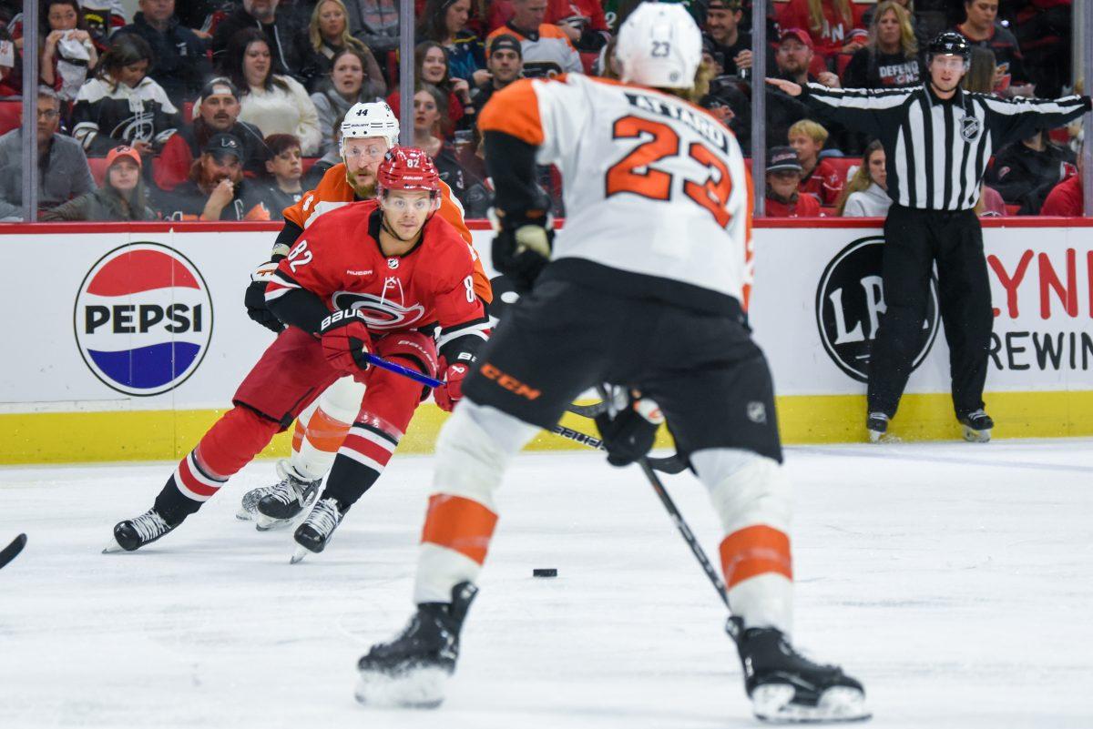 Center Jesperi Kotkaniemi sizes up defenders during the game against the Philadelphia Flyers in PNC Arena on Thursday, March 21, 2024. The Hurricanes defeated the Flyers 3-2 in overtime.