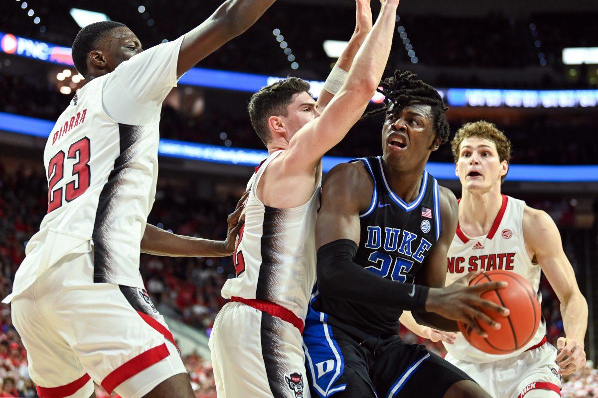 Junior forward Mohamed Diarra, graduate guard Michael O'Connell and junior forward Ben Middlebrooks guard their opponent during the game against Duke in PNC Arena on Monday, March 4, 2024. NC State lost to Duke 79-64.
