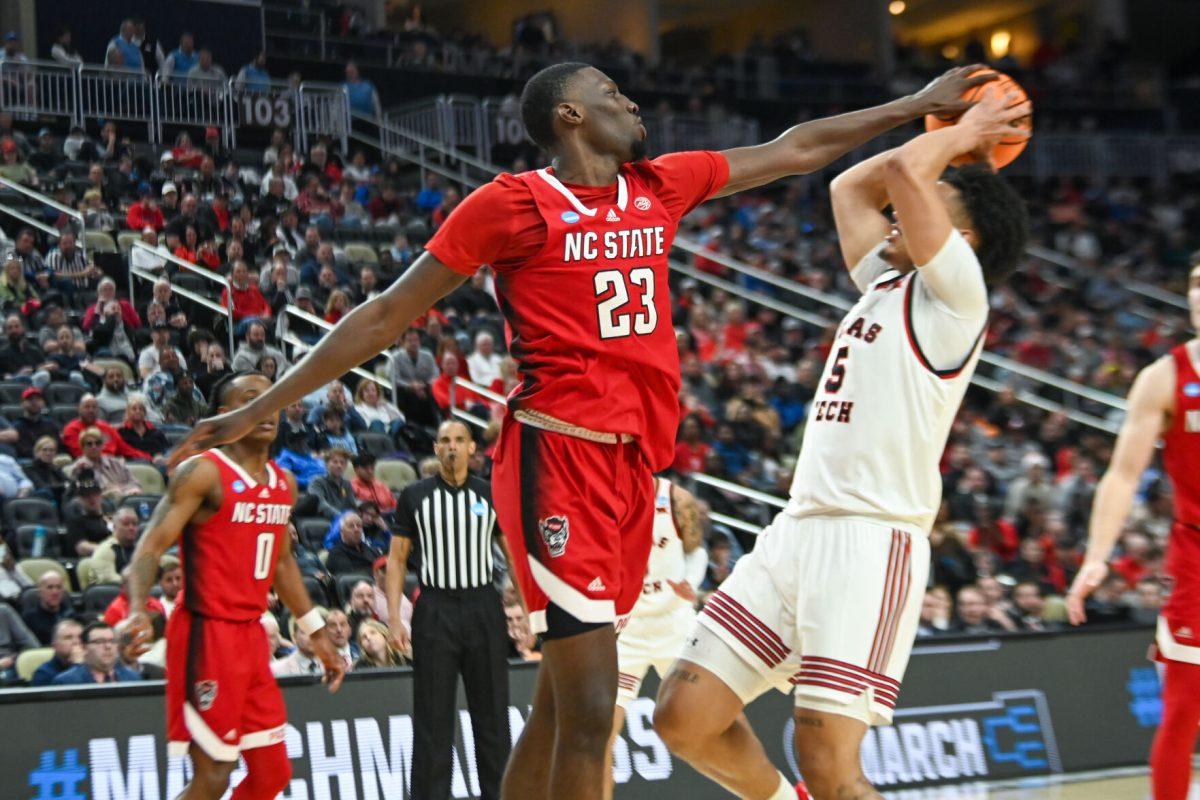 Junior forward Mohamed Diarra blocks a shot during the NCAA March Madness first round game against the Texas Tech Red Raiders in PPG Paints Arena on Thursday, March 21, 2024. Diarra had 12 rebounds. NC State beat Texas Tech 80-67.