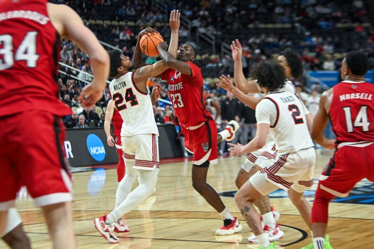 Junior forward Mohamed Diarra grabs a rebound and draws a foul during the NCAA March Madness first round game against the Texas Tech Red Raiders in PPG Paints Arena on Thursday, March 21, 2024. Diarra had 12 rebounds and 17 points. NC State beat Texas Tech 80-67.