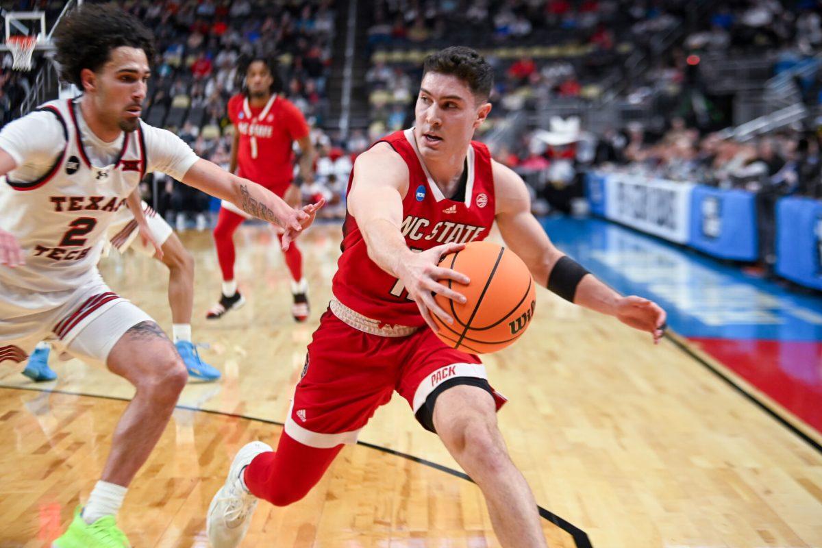 Graduate Guard Michael O'Connell grabs a loose ball during the NCAA March Madness first round game against the Texas Tech Red Raiders in PPG Paints Arena on Thursday, March 21, 2024. O'Connell had six assists and no points. NC State beat Texas Tech 80-67.