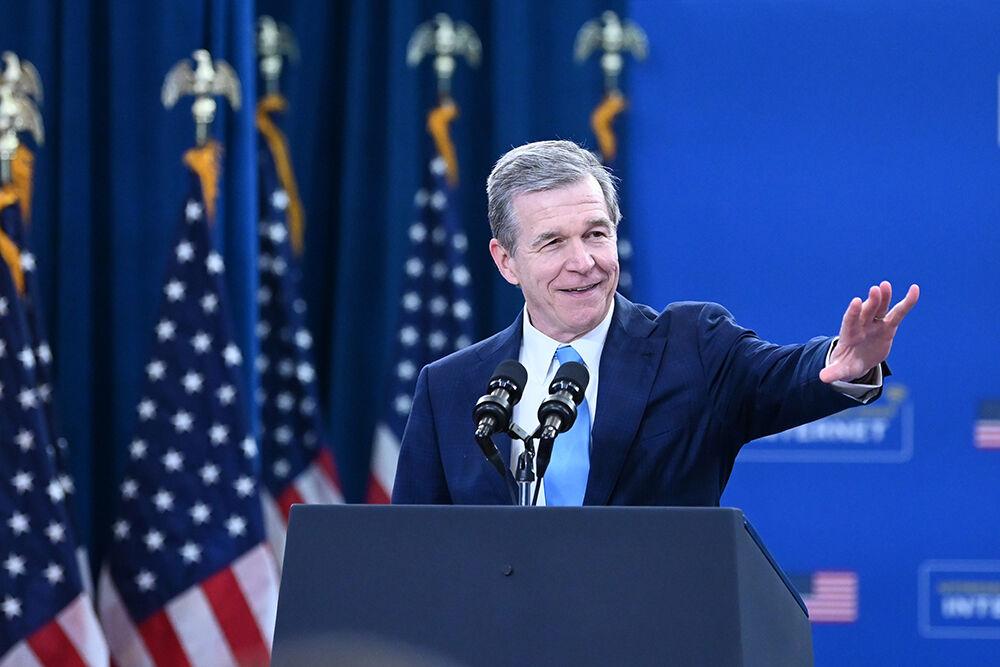 North Carolina Governor Roy Cooper motions to the attendees at the Abbotts Creek Community Center in Raleigh, NC on Thursday, Jan. 18, 2024. President Biden spoke on new investments to connect North Carolina homes to high-speed internet, new, faster rail lines and other developments as a part of the Biden-Harris Administration&#8217;s Investing in America agenda.