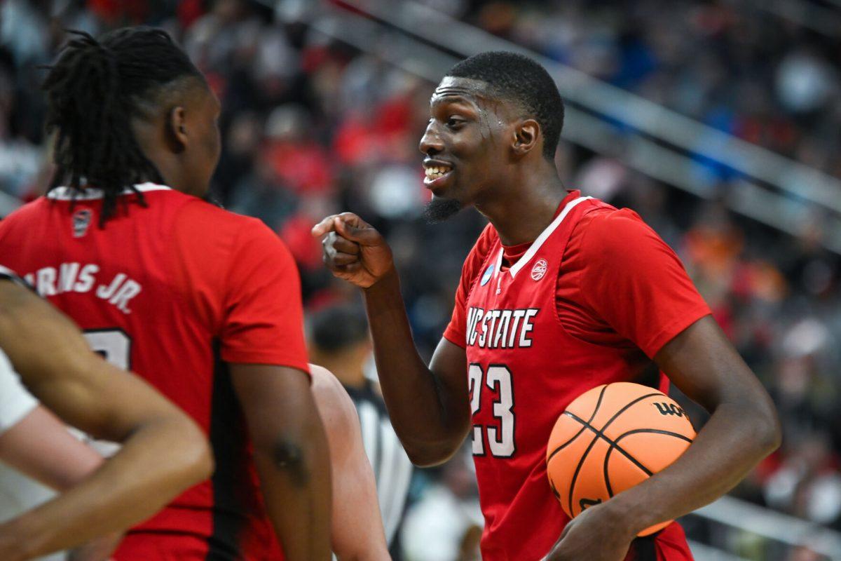 Junior forward Mohamed Diarra encourages graduate forward DJ Burns during the NCAA March Madness first round game against the Texas Tech Red Raiders in PPG Paints Arena on Thursday, March 21, 2024. Diarra had 12 rebounds and 17 points. NC State beat Texas Tech 80-67.