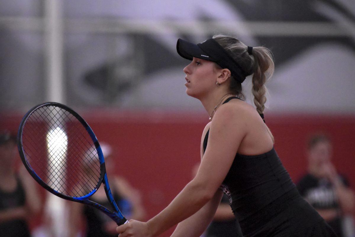 Freshman Gabriella Broadfoot stands prepared for the ball during the match against UNC-Chapel Hill at J.W. Isenhour Tennis Center on Friday, March 22, 2024.&#160;The Wolfpack beat the Tar Heels 4-3.