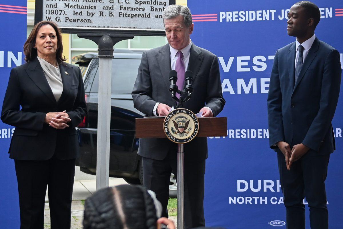 Vice President Kamala Harris (left), North Carolina Governor Roy Cooper (middle), and Deputy Secretary of the Treasury Wally Adeyemo (right), stand during the Vice President's trip to Durham at the Ella West Art Gallery on Friday, March 1, 2024. Vice President Kamala Harris announced $32 million in funds to support North Carolina-based minority entrepreneurs.