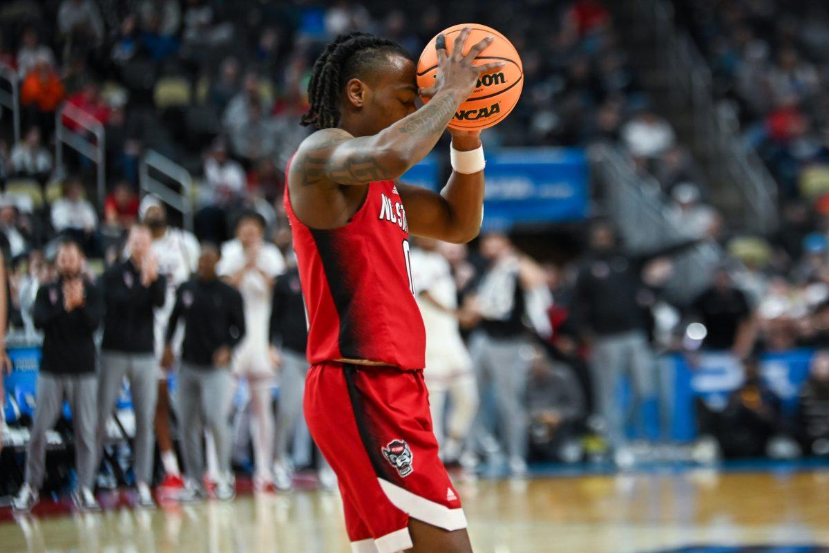 Graduate Guard DJ Horne gets frustrated about a penalty during the NCAA March Madness first round game against the Texas Tech Red Raiders in PPG Paints Arena on Thursday, March 21, 2024. Horne had one steal during the game. NC State beat Texas Tech 80-67.