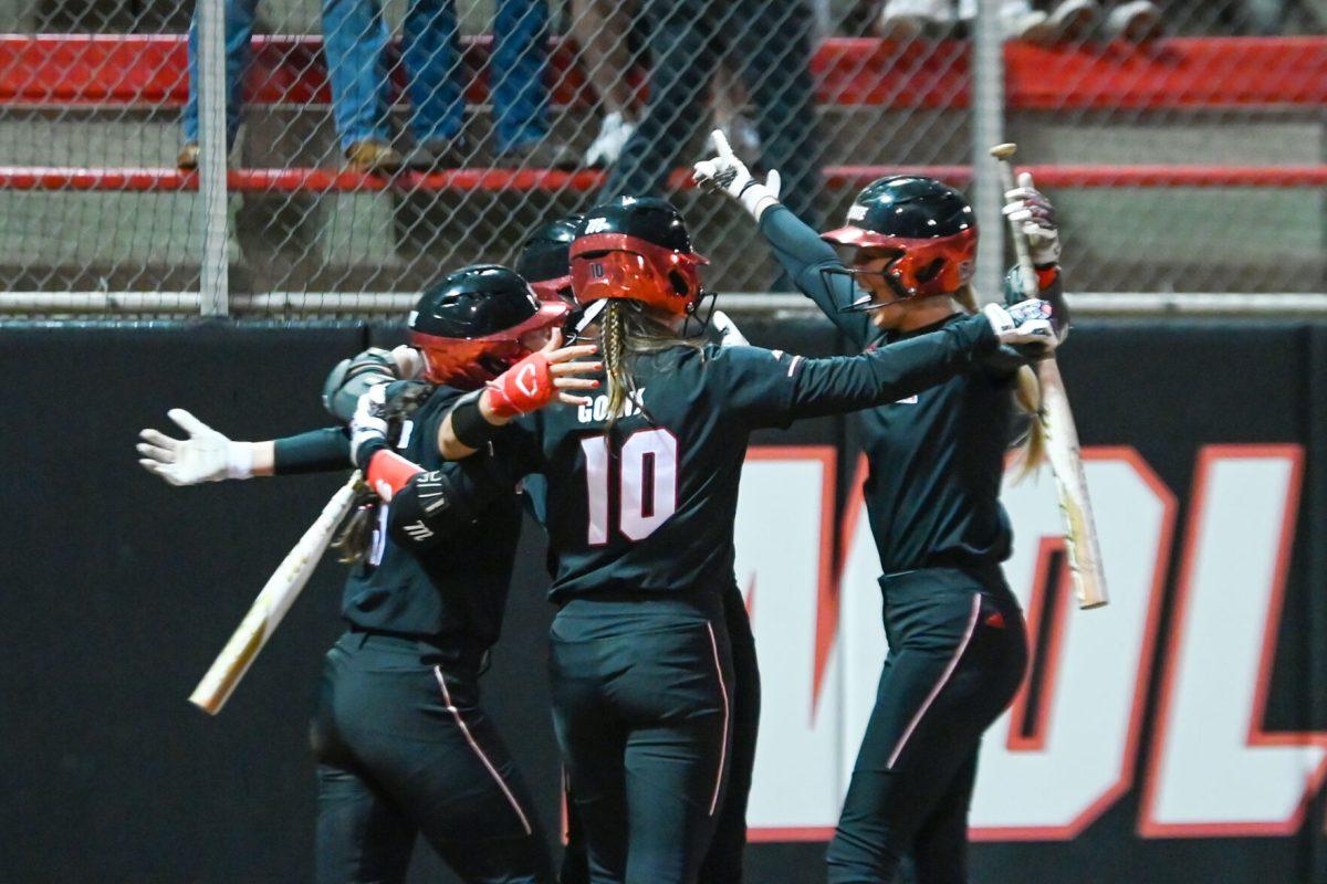 Sophomore pitcher Madison Inscoe, right, celebrates with teammates after her two-run home run in the first inning during the game against UNC-Charlotte at Dail Softball Stadium on Tuesday, March 26, 2024. Inscoe had two RBIs and pitched three innings. The Wolfpack lost to the 49ers 4-2.