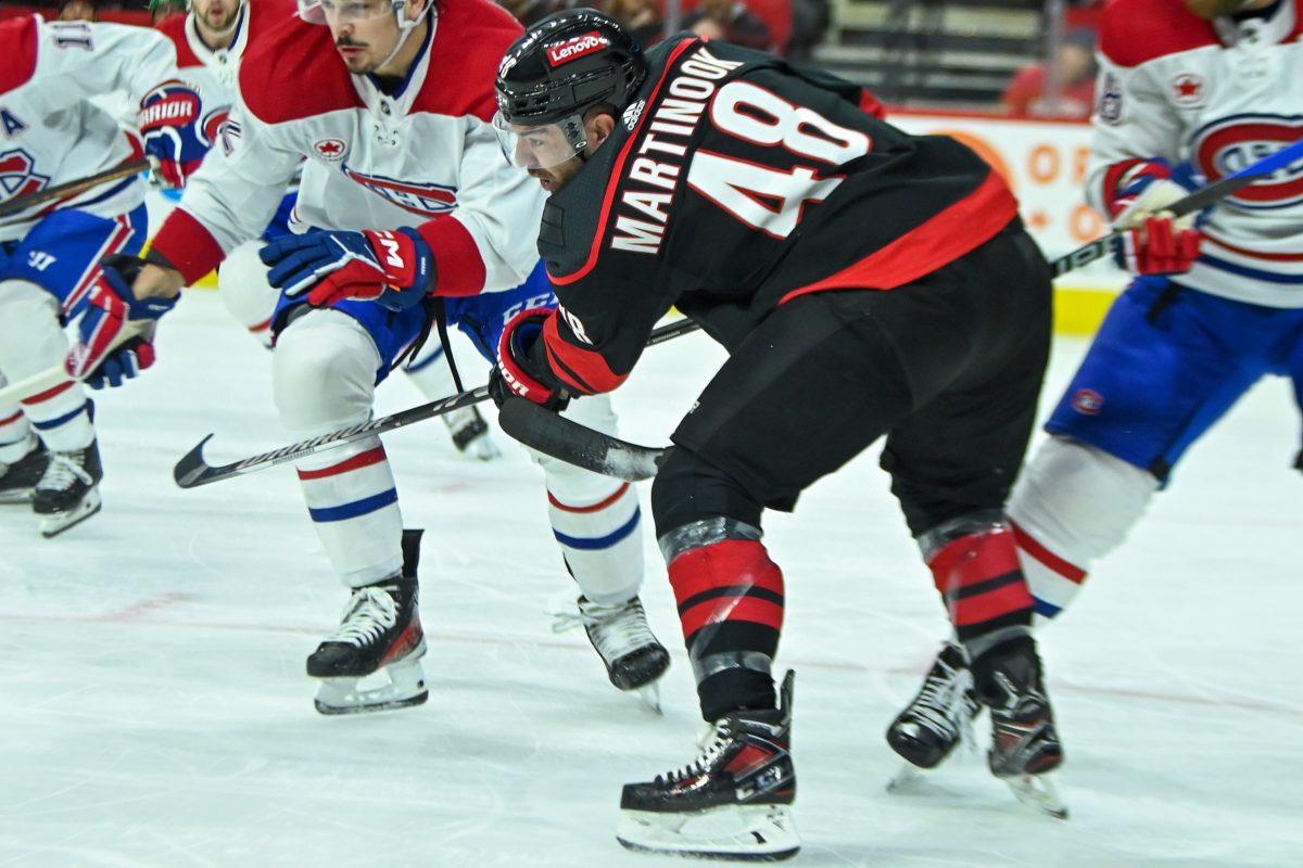 Left wing Jordan Martinook lunges for the puck during the Carolina Hurricanes game versus the Montreal Canadiens on Thursday, March 7, 2024. The Hurricanes beat the Canadiens 4-1.