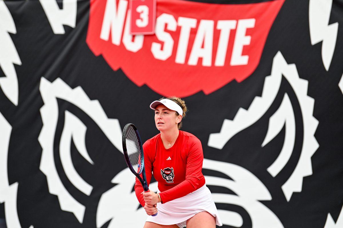 Senior Abigail Rencheli waits to receive the serve during the match against Notre Dame at Dail Outdoor Tennis Stadium on Friday, March 1, 2024. Rencheli won both her doubles and singles matches. NC State beat Notre Dame 5-2.