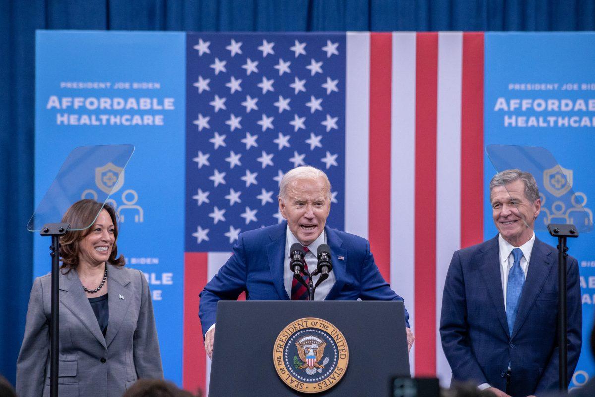 President Joe Biden tells listeners to &#8220;spread the faith&#8221; with Vice President Kamala Harris and Governor Roy Cooper after his speech at the Chavis Community Center in Raleigh, NC on Tuesday, March 26, 2024. Both Vice President Harris and Governor Cooper spoke on the Affordable Care Act and health care before President Biden spoke.