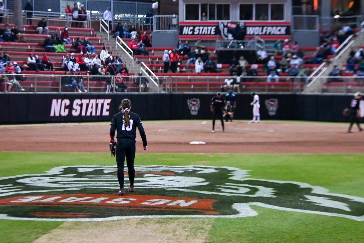 Sophomore outfielder Ellie Goins watches the play develop during the game against UNC-Charlotte at Dail Softball Stadium on Tuesday, March 26, 2024. Goins was left on base twice and got two outs. The Wolfpack lost to the 49ers 4-2.