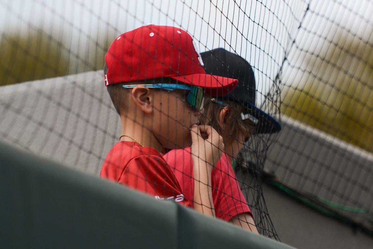 Young NC State fans watch the players anxiously during the game against Duke at Doak Field at Dail Park on Saturday, March 23, 2024. The Wolfpack defeated the Blue Devils 9-8 after scoring six runs in the ninth inning.