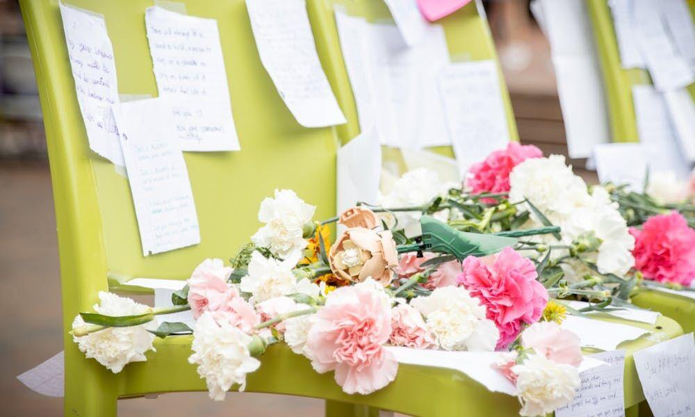 A makeshift memorial was set up in UNC-Chapel Hill's Pit on Oct. 11, 2021, as students and faculty mourned the losses of students to suicide of the weekend. Passersby left notes of encouragement and flowers.