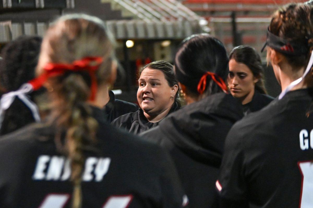 Head coach Lindsay Leftwich addresses the team following the game against UNC-Charlotte at Dail Softball Stadium on Tuesday, March 26, 2024. The Wolfpack lost to the 49ers 4-2.