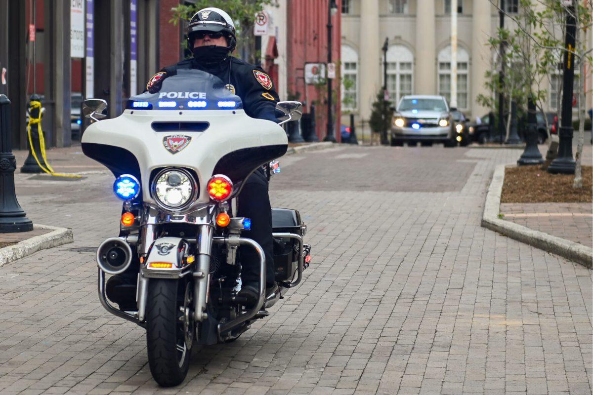 Police escort government officials during Kamala Harris's trip to Durham at the Ella West Art Gallery on Friday, March 1, 2024. Vice President Kamala Harris announced $32 million in funds to support North Carolina-based minority entrepreneurs.