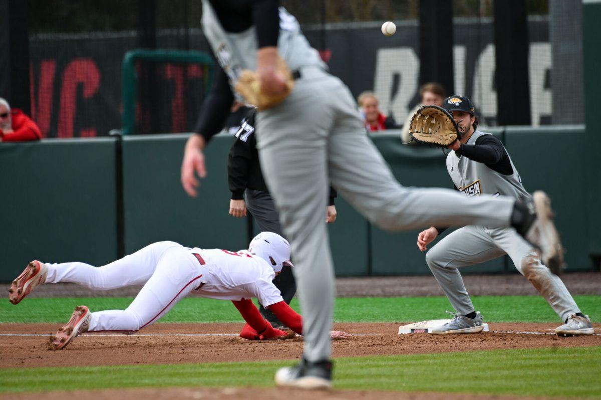 Sophomore infielder Matt Heavner jumps to first before getting tagged during the baseball game against Towson at Doak Field at Dail Park on Friday, March 1, 2024. NC State beat Towson 6-5.
