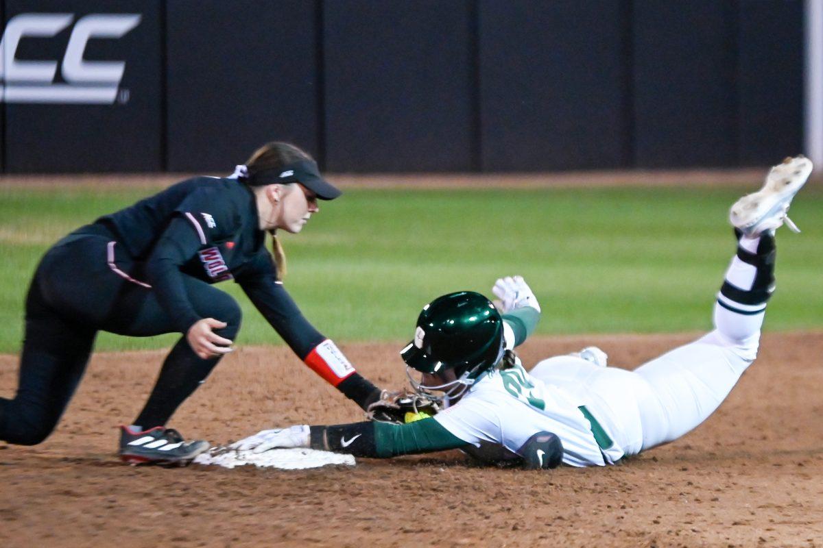 Senior infielder Kaylee Lambrecht attempts to tag out a runner at second base during the game against UNC-Charlotte at Dail Softball Stadium on Tuesday, March 26, 2024. The tag went through review and the runner was called safe. The Wolfpack lost to the 49ers 4-2.