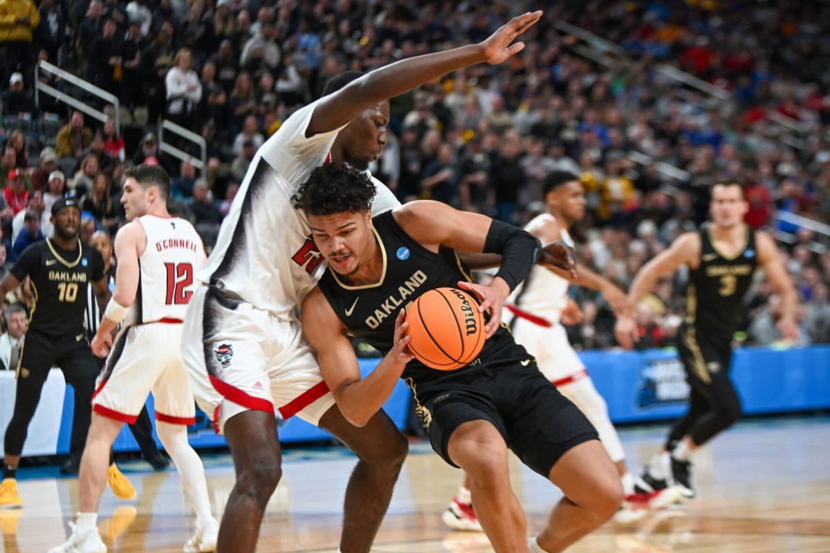 Junior forward Mohamed Diarra defends the basket during the NCAA March Madness round two game against the Oakland University Golden Grizzlies in PPG Paints Arena on Saturday, March 23, 2024. Diarra had 13 rebounds. The Wolfpack beat the Golden Grizzlies 79-73 in overtime.