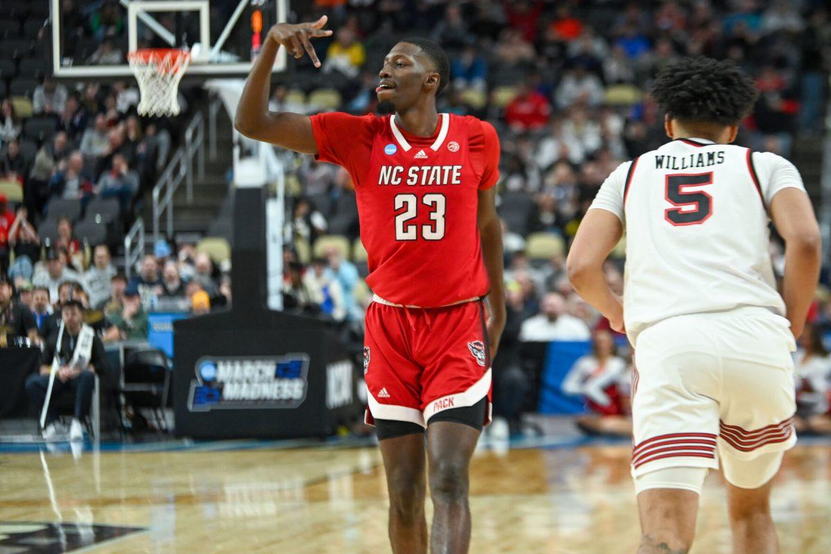 Junior forward Mohamed Diarra celebrates during the NCAA March Madness first round game against the Texas Tech Red Raiders in PPG Paints Arena on Thursday, March 21, 2024. Diarra had 12 rebounds and 17 points. NC State beat Texas Tech 80-67.