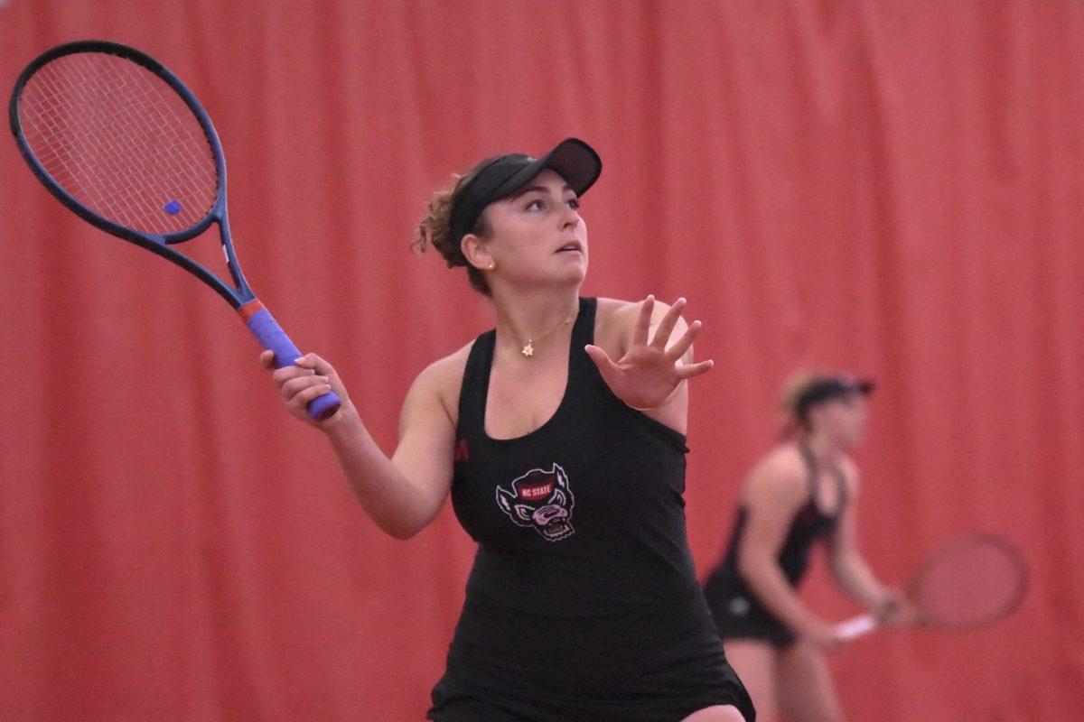Senior Abigail Rencheli prepares to return the ball during the match against UNC-Chapel Hill at J.W. Isenhour Tennis Center on Friday, March 22, 2024.&#160;The Wolfpack beat the Tar Heels 4-3.