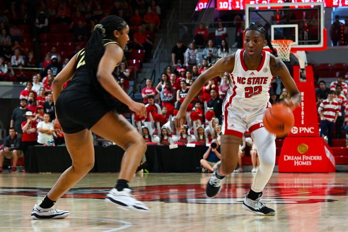 Junior guard Saniya Rivers drives to the basket during the game against Wake Forest in Reynolds Coliseum on Sunday, March 3, 2024. NC State won against Wake Forest 75-57. Rivers finished with 23 points.