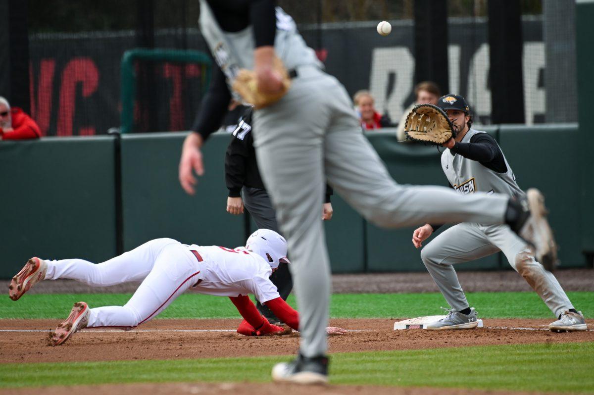 Sophomore infielder Matt Heavner jumps to first before getting tagged during the baseball game against Towson at Doak Field at Dail Park on Friday, March 1, 2024. NC State beat Towson 6-5.