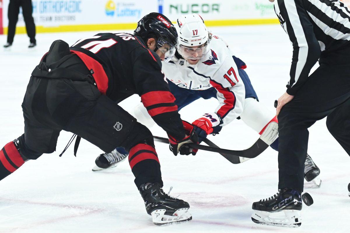 Center Seth Jarvis fights for the puck during the Carolina Hurricanes game versus the Washington Capitals at PNC Arena on Friday, April 5, 2024. The Hurricanes beat the Capitals 4-2.