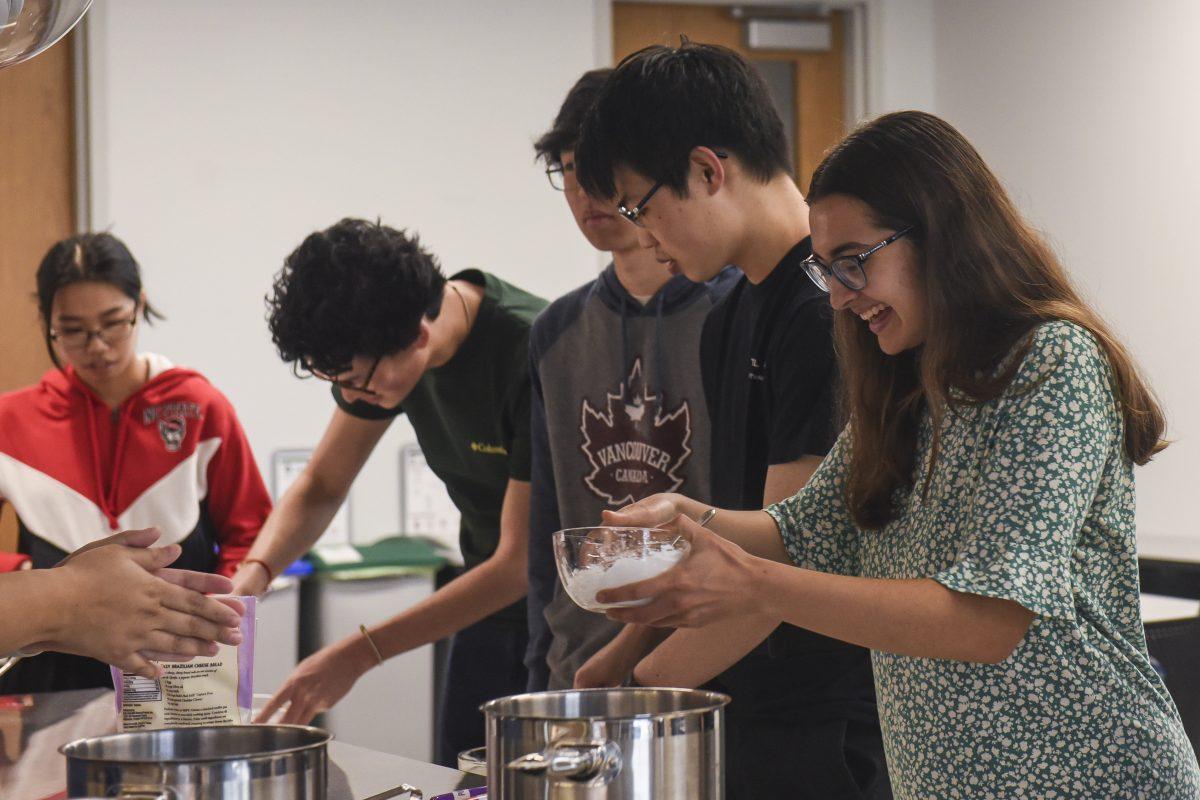 Students mix tapioca flour into dough at the APISAA Heritage Month Teaching Kitchen Event in the Carmichael Gym Teaching Kitchen on Thursday, March 28, 2024. The event taught students about the history of boba and how to make tapioca pearls.