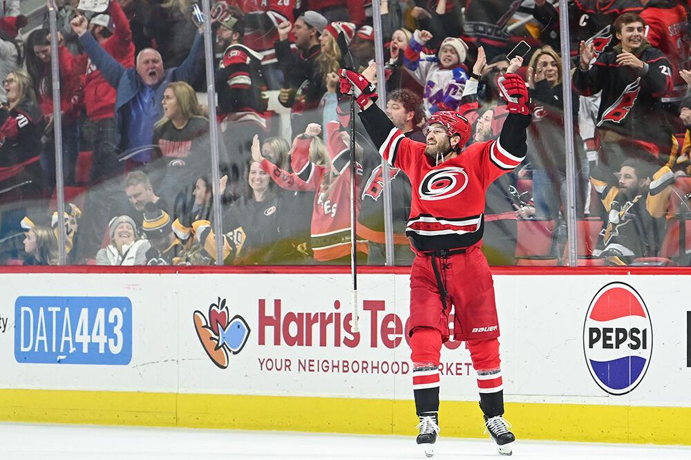 Carolina Hurricanes defenseman Brett Pesce celebrates scoring a goal to win the game against the Pittsburgh Penguins in PNC Arena on Saturday, Jan. 13, 2024. Pesce scored two goals. The Hurricanes beat the Penguins 3-2 in overtime.