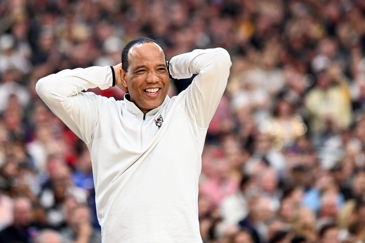 Head coach Kevin Keatts smiles in frustration over a call during the NCAA Tournament Final Four game against Purdue at State Farm Stadium in Glendale, Arizona on Saturday, April 6, 2024. NC State lost to Purdue 63-50.