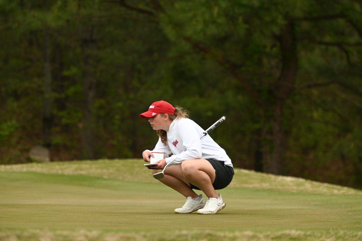 Freshman Ellise Rymer lines up for her final putt of the day during the Wolfpack Match Play at Lonnie Poole Golf Course on Tuesday, April 9, 2024. The Wolfpack finished sixth overall in its final regular season stitch.