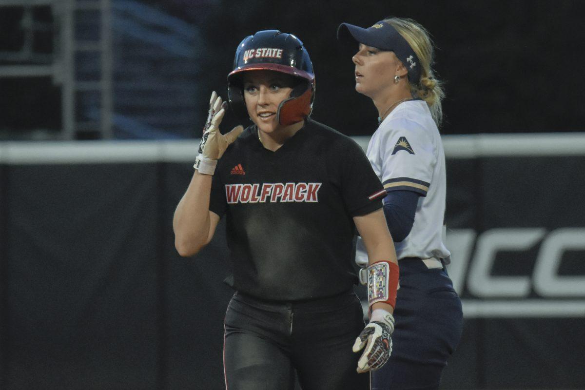 Senior infielder Kaylee Lambrecht walks back to the dugout after getting tagged out during the second game of the doubleheader against Queens University at Dail Softball Stadium on Tuesday, April 9, 2024. Lambrecht had two at bats. NC State won the game 8-1.