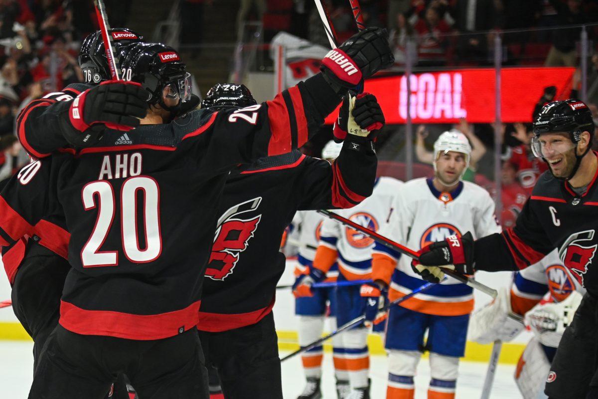 The Carolina Hurricanes celebrate a last-minute goal during the game against the New York Islanders in PNC Arena on Thursday, Nov. 30, 2023. The Hurricanes scored with under three seconds remaining in the game to tie the Islanders 4-4 sending the game to overtime. The Islanders beat the Hurricanes 5-4 in overtime.