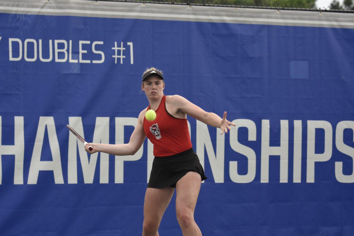 Senior Amelia Rajecki eyes the ball down during the ACC Tournament quarterfinals match against Clemson at Cary Tennis Park on Friday, April 19, 2024. Rajecki won both her doubles and singles matches. NC State beat Clemson 4-0.