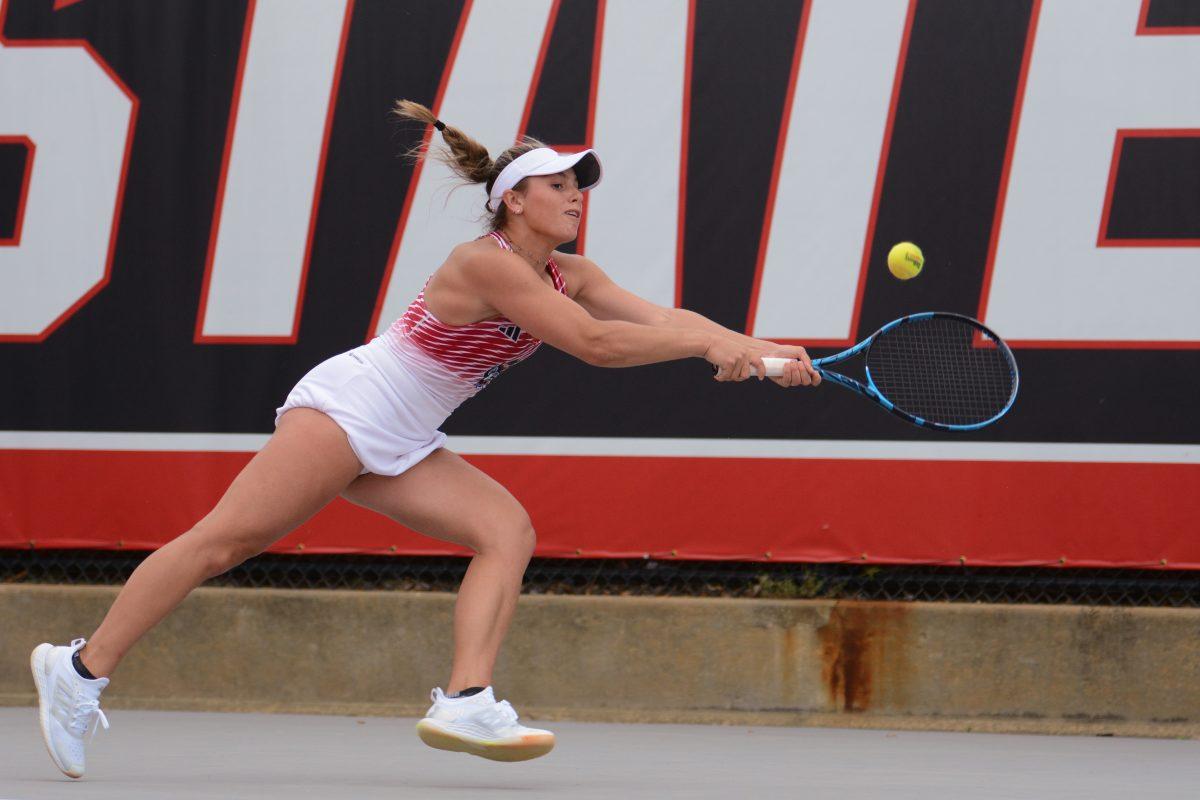 Freshman Gabriella Broadfoot runs for the ball during the match against Miami at Dail Outdoor Tennis Stadium on Friday, April 5, 2024. NC State beat Miami 4-3.
