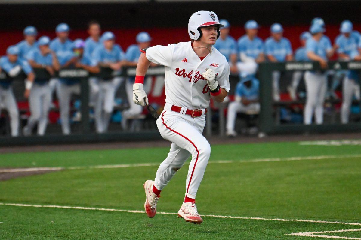 Freshman infielder Luke Nixon runs to first base during the game against UNC-Chapel Hill at Doak Field at Dail Park on Thursday, April 18, 2024. NC State won 9-8.