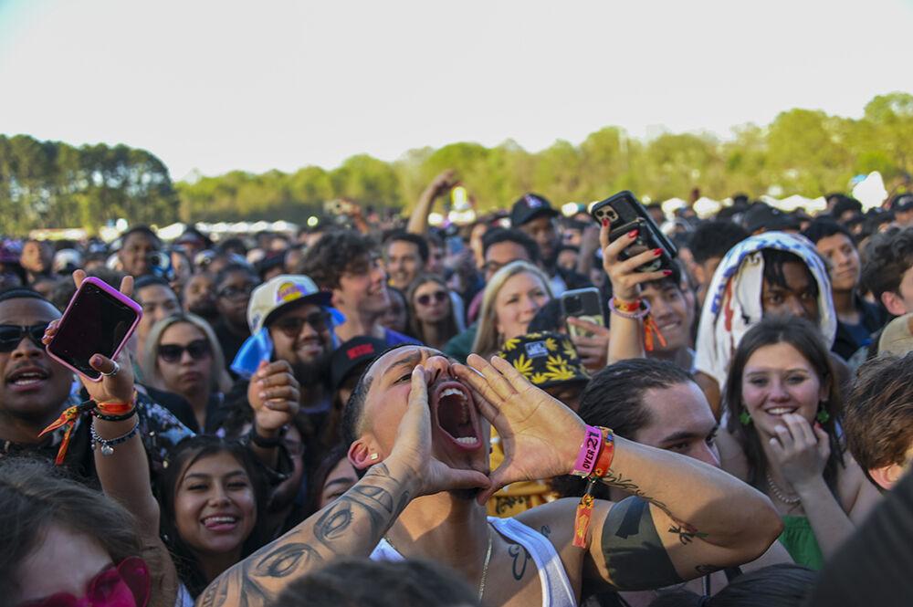 Festival attendees shout before the next set starts during the Dreamville Festival at Dorothea Dix Park on Saturday, April 1, 2023. Multiple artists including Usher, EarthGang, City Girls and Ari Lennox performed on the first night of the festival.