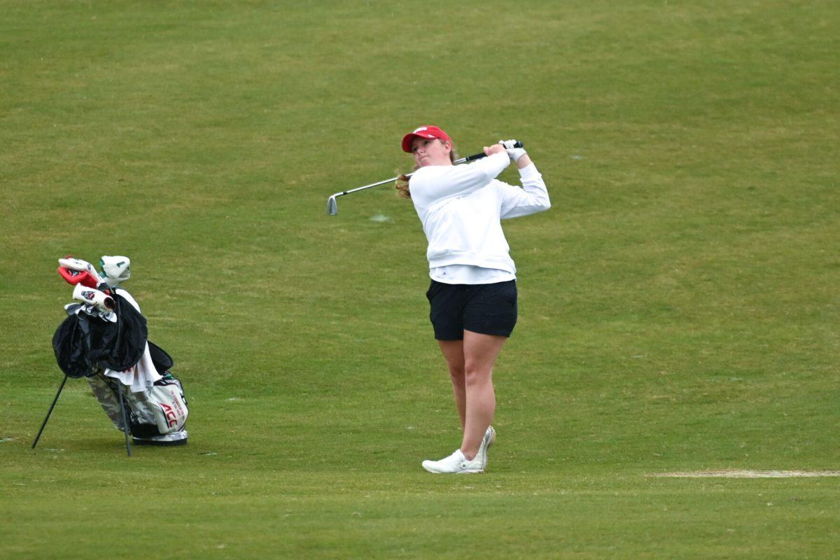 Freshman Ellise Rymer tees off on the 18th hole during the Wolfpack Match Play at Lonnie Poole Golf Course on Tuesday, April. 9, 2024. The Wolfpack finished sixth overall in its final regular season stitch.