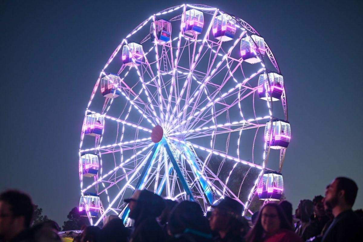 A ferris wheel turns during the Dreamville Festival at Dorothea Dix Park on Saturday, April 6, 2024. The festival offered a variety of sponsored activites from partnered brands like Charmin, Monster and Febreeze.