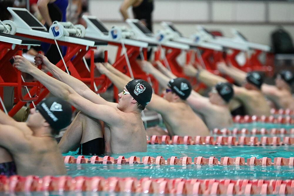 The men prepare for a heat during the swimming and diving meet against UNC-Wilmington at Willis R. Casey Aquatic Center on Friday, Feb. 2, 2024. The NC State men's team beat Wilmington 172-104.