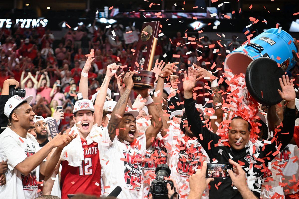 NC State celebrates after the NCAA Tournament Elite 8 game against Duke at American Airlines Center in Dallas on Sunday, March 31, 2024. NC State beat Duke 76-64 to advance to the Final Four.